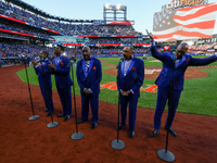 The Temptations sing the National Anthem on the field before Game 5 of a baseball NL Championship Series between the Los Angeles Dodgers and...