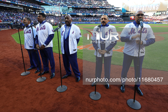 The Temptations sing the National Anthem on the field before Game 5 of a baseball NL Championship Series between the Los Angeles Dodgers and...