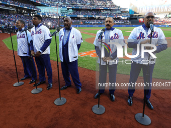 The Temptations sing the National Anthem on the field before Game 5 of a baseball NL Championship Series between the Los Angeles Dodgers and...