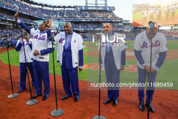 The Temptations sing the National Anthem on the field before Game 5 of a baseball NL Championship Series between the Los Angeles Dodgers and...