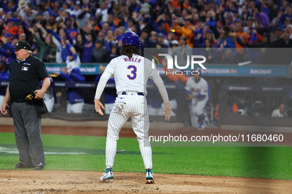 Jesse Winker #3 of the New York Mets scores during the LOREM inning in Game 5 of the baseball NL Championship Series against the Los Angeles...