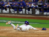 Jesse Winker #3 of the New York Mets scores on a sacrifice fly during the sixth inning in Game 5 of the baseball NL Championship Series agai...