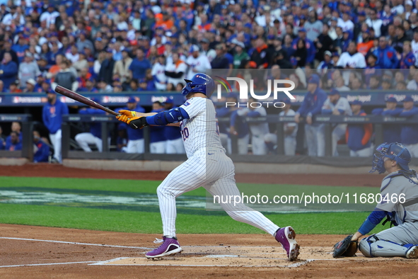 Pete Alonso #20 of the New York Mets hits a home run during the first inning in Game 5 of the baseball NL Championship Series against the Lo...