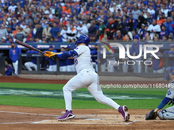 Pete Alonso #20 of the New York Mets hits a home run during the first inning in Game 5 of the baseball NL Championship Series against the Lo...