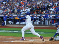 Pete Alonso #20 of the New York Mets hits a home run during the first inning in Game 5 of the baseball NL Championship Series against the Lo...