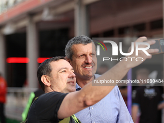 Guenther Steiner takes a photo with a fan at Circuit of the Americas in Austin, Texas, on October 18, 2024, during the Formula 1 Pirelli Uni...