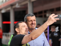 Guenther Steiner takes a photo with a fan at Circuit of the Americas in Austin, Texas, on October 18, 2024, during the Formula 1 Pirelli Uni...