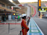 Pit marshals wait in pit lane for an inspection at Circuit of the Americas in Austin, United States, on October 18, 2024, during the Formula...