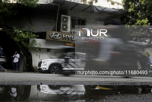 The signage of Hyundai Motor India Ltd. is seen in front of an authorized Hyundai vehicle workshop in Mumbai, India, on October 19, 2024. Th...