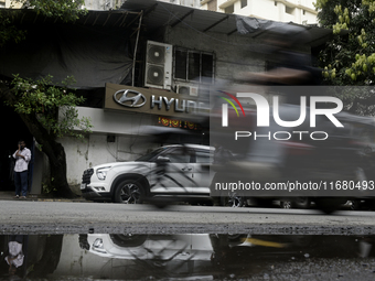 The signage of Hyundai Motor India Ltd. is seen in front of an authorized Hyundai vehicle workshop in Mumbai, India, on October 19, 2024. Th...