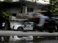 The signage of Hyundai Motor India Ltd. is seen in front of an authorized Hyundai vehicle workshop in Mumbai, India, on October 19, 2024. Th...