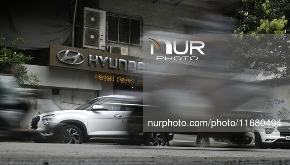 The signage of Hyundai Motor India Ltd. is seen in front of an authorized Hyundai vehicle workshop in Mumbai, India, on October 19, 2024. Th...