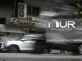 The signage of Hyundai Motor India Ltd. is seen in front of an authorized Hyundai vehicle workshop in Mumbai, India, on October 19, 2024. Th...