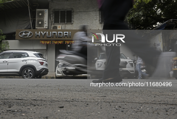 The signage of Hyundai Motor India Ltd. is seen in front of an authorized Hyundai vehicle workshop in Mumbai, India, on October 19, 2024. Th...