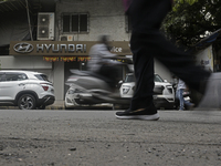 The signage of Hyundai Motor India Ltd. is seen in front of an authorized Hyundai vehicle workshop in Mumbai, India, on October 19, 2024. Th...