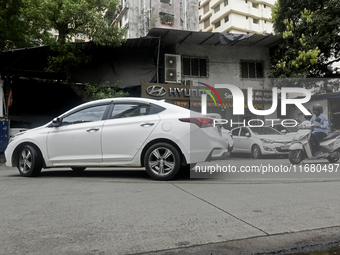 The signage of Hyundai Motor India Ltd. is seen in front of an authorized Hyundai vehicle workshop in Mumbai, India, on October 19, 2024. Th...