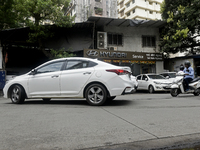 The signage of Hyundai Motor India Ltd. is seen in front of an authorized Hyundai vehicle workshop in Mumbai, India, on October 19, 2024. Th...