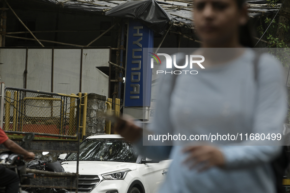 The signage of Hyundai Motor India Ltd. is seen in front of an authorized Hyundai vehicle workshop in Mumbai, India, on October 19, 2024. Th...