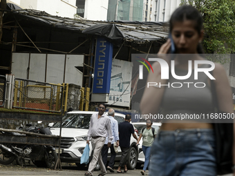 The signage of Hyundai Motor India Ltd. is seen in front of an authorized Hyundai vehicle workshop in Mumbai, India, on October 19, 2024. Th...