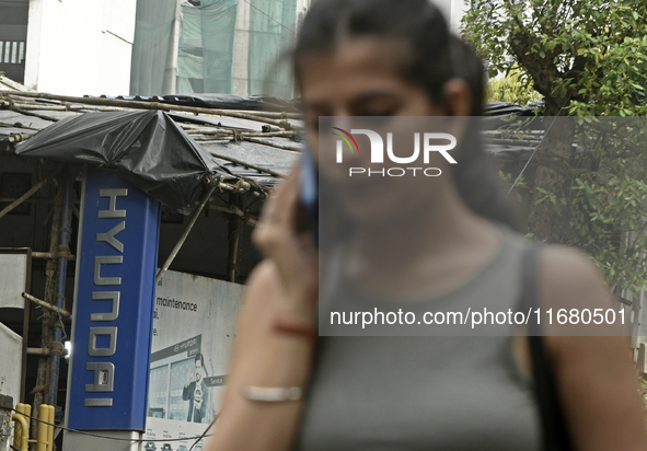 The signage of Hyundai Motor India Ltd. is seen in front of an authorized Hyundai vehicle workshop in Mumbai, India, on October 19, 2024. Th...