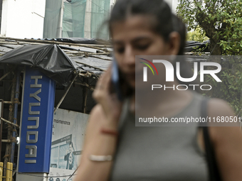 The signage of Hyundai Motor India Ltd. is seen in front of an authorized Hyundai vehicle workshop in Mumbai, India, on October 19, 2024. Th...