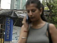 The signage of Hyundai Motor India Ltd. is seen in front of an authorized Hyundai vehicle workshop in Mumbai, India, on October 19, 2024. Th...