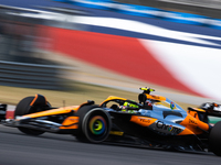 Lando Norris drives in a free practice session at Circuit of the Americas in Austin, United States, on October 18, 2024, during the Formula...