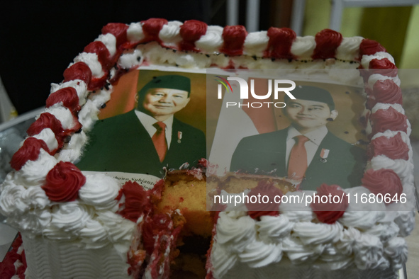 A tart with pictures of Indonesia's new president Prabowo Subianto and vice president Gibran Rakabuming Raka is prepared for a special editi...