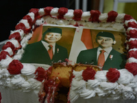 A tart with pictures of Indonesia's new president Prabowo Subianto and vice president Gibran Rakabuming Raka is prepared for a special editi...