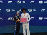 Max Verstappen of the Netherlands drives the Oracle Red Bull Racing RB20 Honda RBPT, and Leo Neugebauer participates during the Formula 1 Pi...