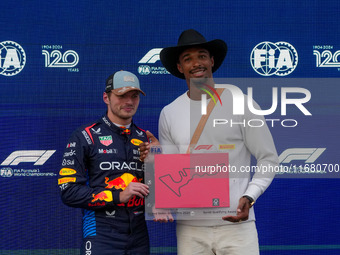 Max Verstappen of the Netherlands drives the Oracle Red Bull Racing RB20 Honda RBPT, and Leo Neugebauer participates during the Formula 1 Pi...