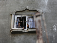 Palestinians inspect the damage to a building following Israeli bombardment in the Maghazi camp for Palestinian refugees in the central Gaza...