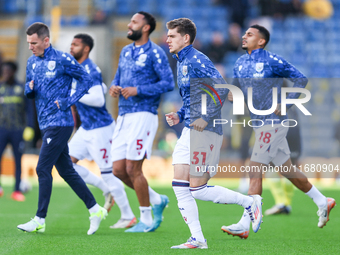 Tom Fellows of WBA warms up with teammates during the Sky Bet Championship match between Oxford United and West Bromwich Albion at the Kassa...