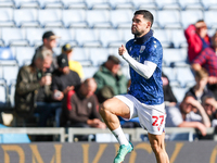 Number 27, Alex Mowatt of WBA, warms up during the Sky Bet Championship match between Oxford United and West Bromwich Albion at the Kassam S...