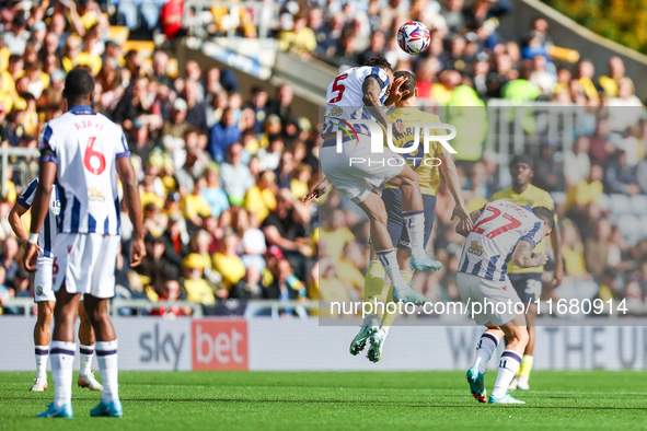 Number 5, Kyle Bartley of WBA, and number 9, Mark Harris of Oxford, battle in the air during the Sky Bet Championship match between Oxford U...