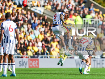 Number 5, Kyle Bartley of WBA, and number 9, Mark Harris of Oxford, battle in the air during the Sky Bet Championship match between Oxford U...