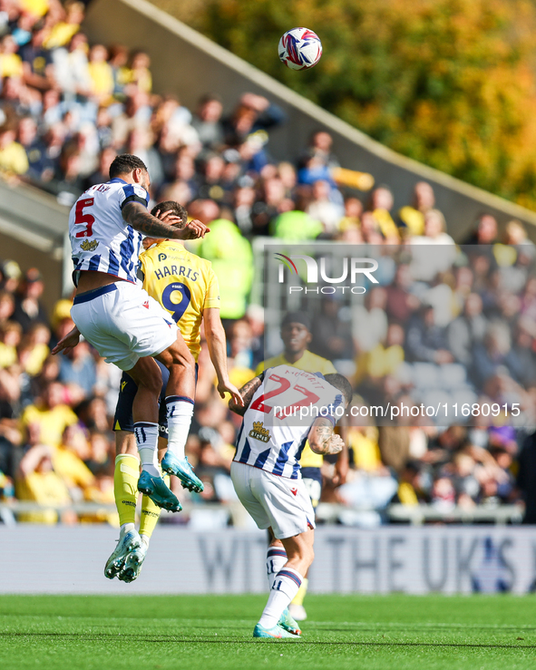 Number 5, Kyle Bartley of WBA, and number 9, Mark Harris of Oxford, battle in the air during the Sky Bet Championship match between Oxford U...