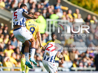 Number 5, Kyle Bartley of WBA, and number 9, Mark Harris of Oxford, battle in the air during the Sky Bet Championship match between Oxford U...