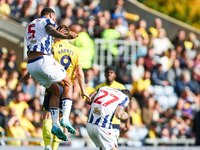 Number 5, Kyle Bartley of WBA, and number 9, Mark Harris of Oxford, battle in the air during the Sky Bet Championship match between Oxford U...