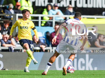 Number 19, Tyler Goodrham of Oxford, is in action during the Sky Bet Championship match between Oxford United and West Bromwich Albion at th...