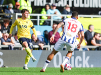 Number 19, Tyler Goodrham of Oxford, is in action during the Sky Bet Championship match between Oxford United and West Bromwich Albion at th...