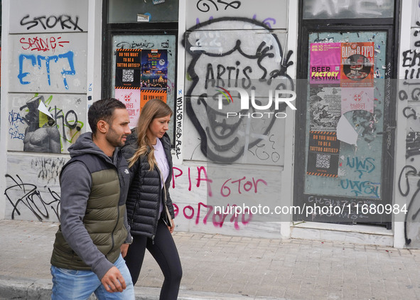 People walk in Athens, Greece, on October 19, 2024. 