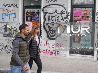 People walk in Athens, Greece, on October 19, 2024. (