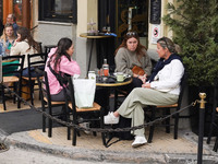 People drink coffee in Athens, Greece, on October 19, 2024. (