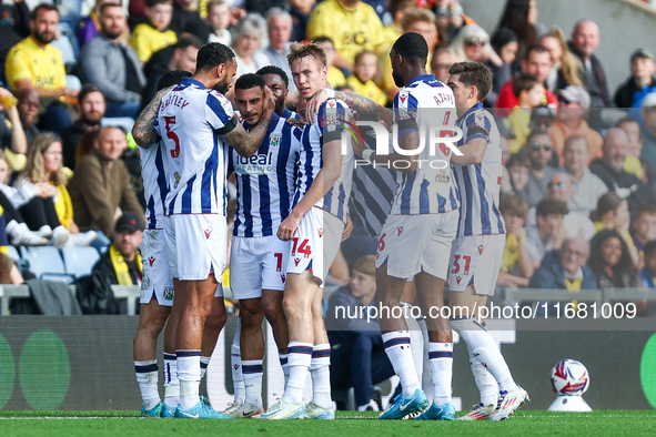 #5, Kyle Bartley congratulates #18, Karlan Grant of WBA (facing camera) for his goal during the Sky Bet Championship match between Oxford Un...