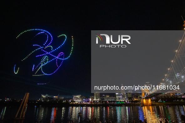 Spectators see the drone light show at the 2024 Blink Art and Light Festival in Cincinnati, Ohio, on October 18, 2024. 