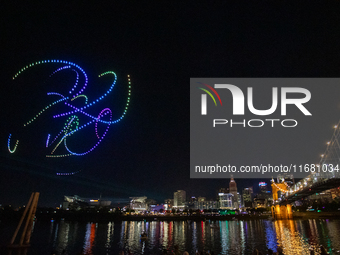 Spectators see the drone light show at the 2024 Blink Art and Light Festival in Cincinnati, Ohio, on October 18, 2024. (