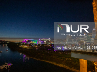 Paycor Stadium is lit up in neon during the 2024 Blink Art and Light Festival in Cincinnati, Ohio, on October 18, 2024. (