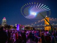 Spectators are seen during a light exhibit at the 2024 Blink Art and Light Festival in Cincinnati, Ohio, on October 18, 2024. (