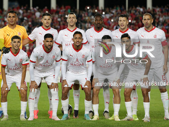 The starting players of CR Belouizdad pose for a group photo before the football match between USM Alger and CR Belouizdad on the 5th day of...